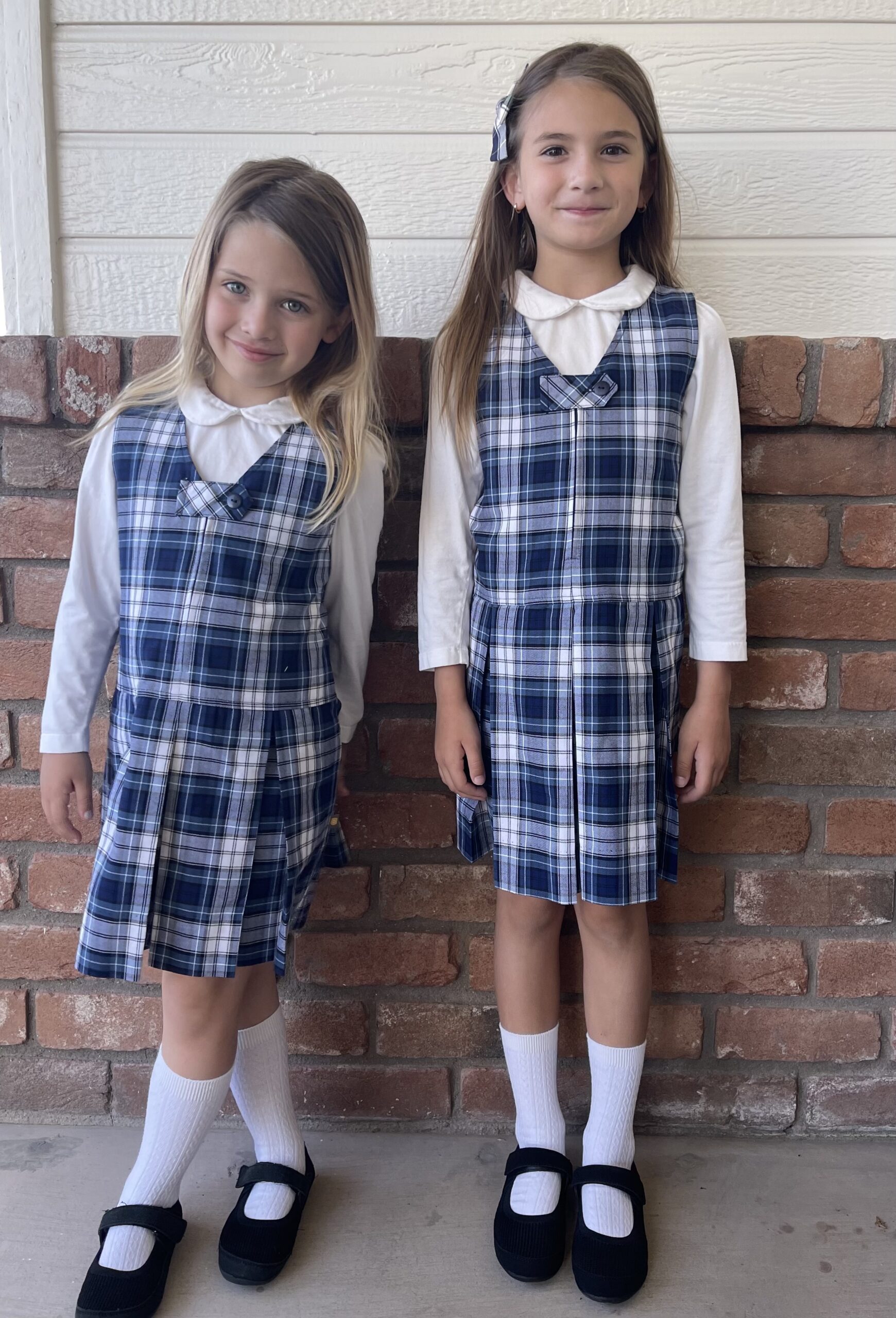 two girls in school uniforms